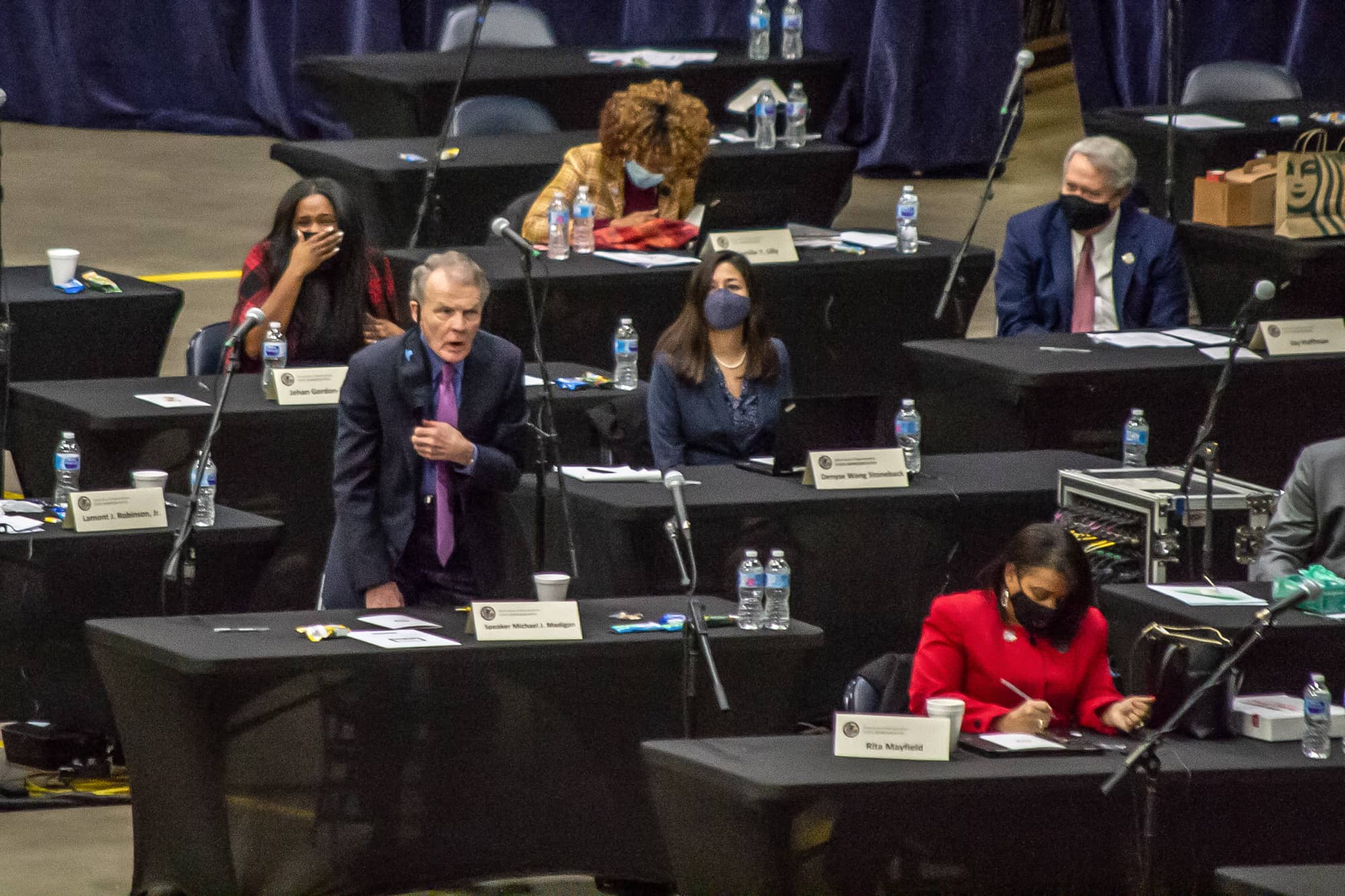 Former House Speaker Michael Madigan is pictured voting for his successor, Emanuel “Chris” Welch, on the floor of the Bank of Springfield Center in January 2021. It was serving as the House chamber at the time due to social distancing requirements brought on by the COVID-19 pandemic. (Capitol News Illinois photo by Jerry Nowicki)