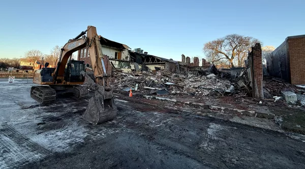 Work got underway Thursday afternoon to demolish a building at 179 N. Cherry St. damaged by a fire on Dec. 5, 2024.