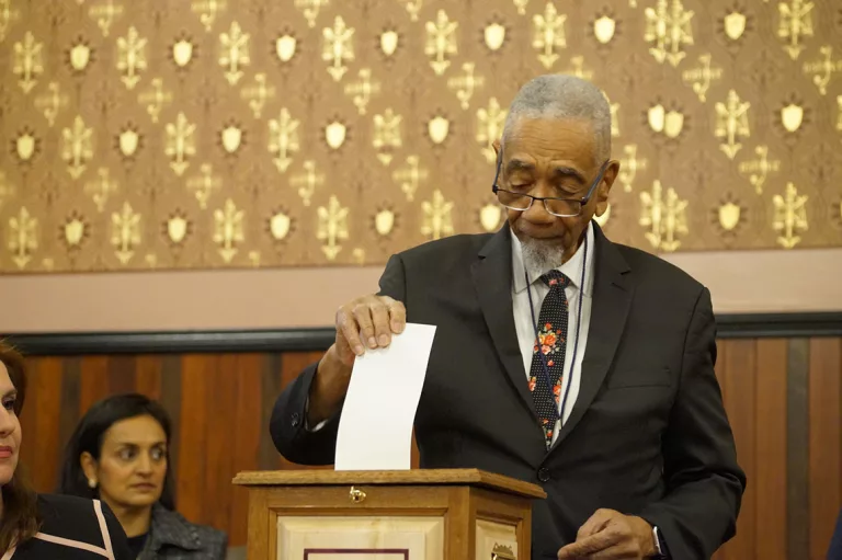 Former U.S. Congressman Bobby Rush, one of Illinois’ presidential electors, places his vote for Vice President Kamala Harris as part of the state’s Electoral College vote.