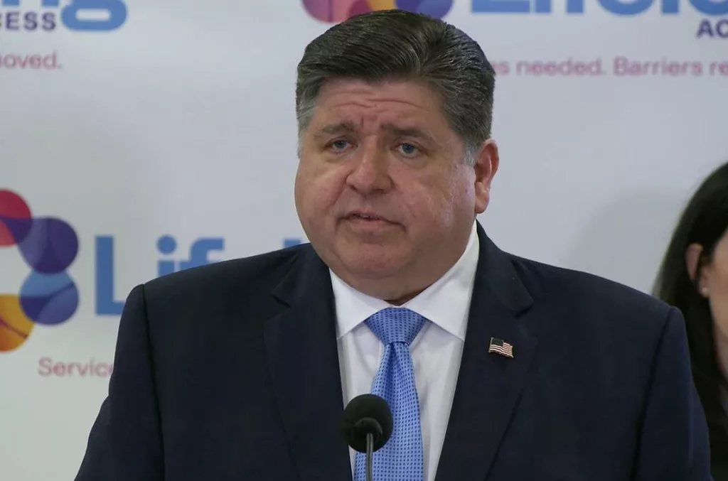 Gov. JB Pritzker takes questions from reporters at an event in Normal on Tuesday, criticizing House Speaker Emanuel “Chris” Welch for not calling a bill to regulate “intoxicating” hemp products.