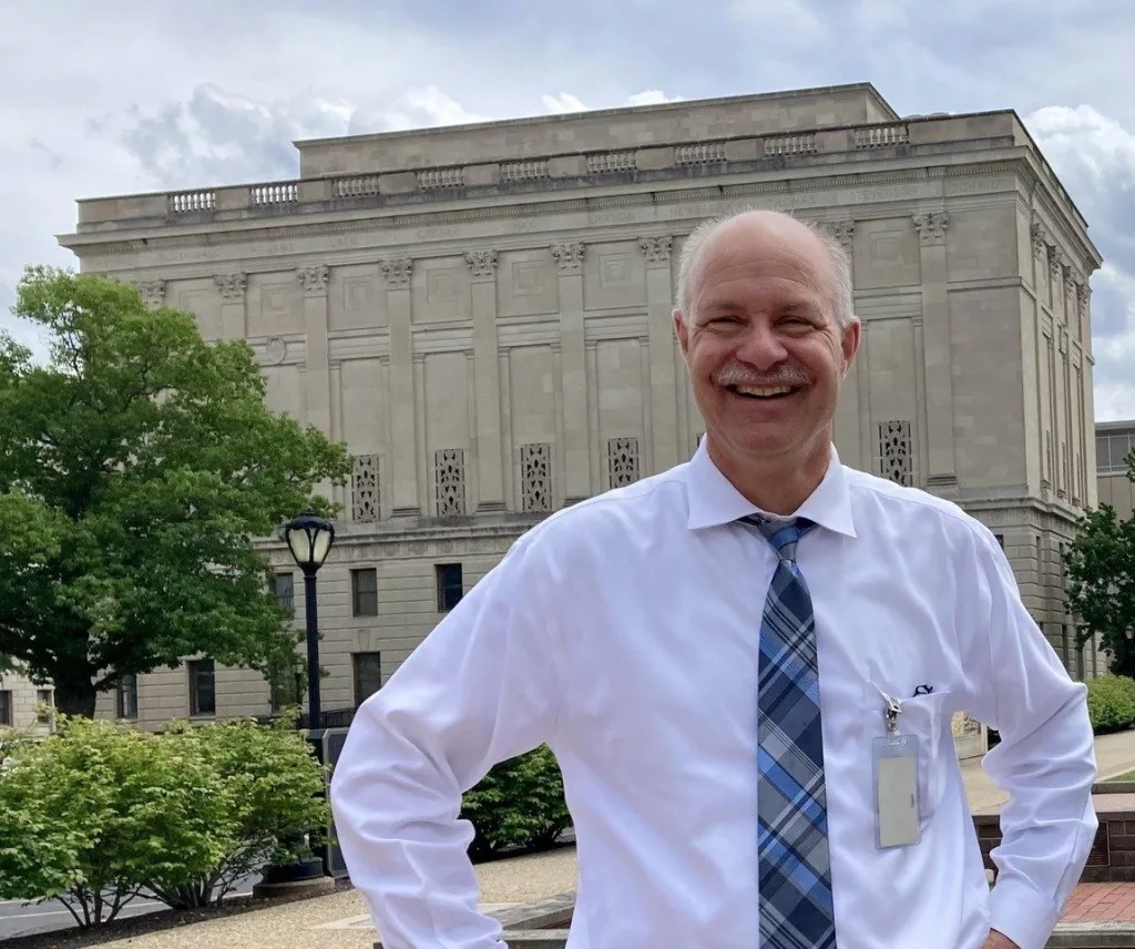 2: Retired Illinois State Archivist Dave Joens stands in front of the Margaret Cross Norton Building in Springfield. 