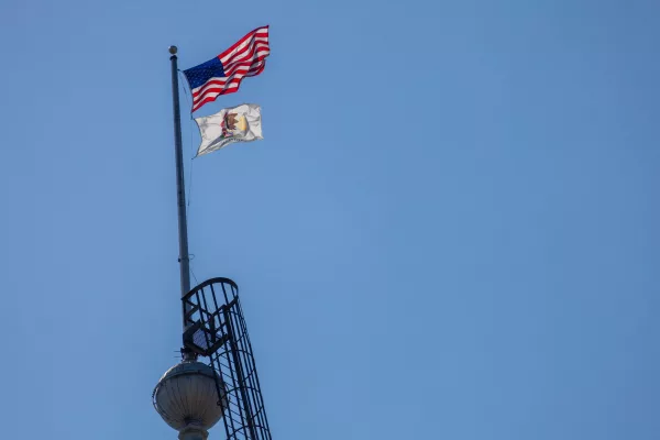 The U.S. and Illinois flags over the state capitol in Springfield in May 2024.