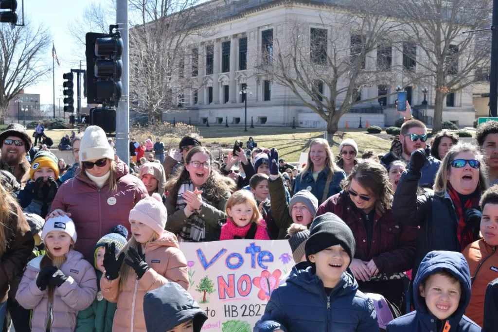 Homeschool advocates rally at the Illinois Statehouse to oppose legislation that would impose more oversight of parents who school their children at home. 