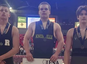 Knoxville Jr. High School's James Long, center, won the 185 Class A championship at the Illinois Elementary School Association State Wrestling Tournament on Saturday at the NIU Convocation Center in DeKalb.