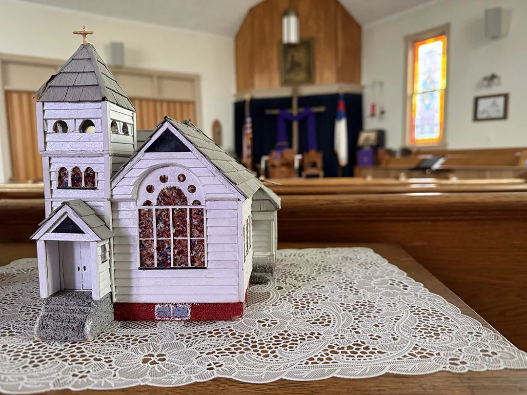 A replica of Gerlaw Christian Church sits in the sanctuary on Saturday afternoon. A storm that packed winds between 60 and 80 mph ripped off the steeple of the historic church Friday night.