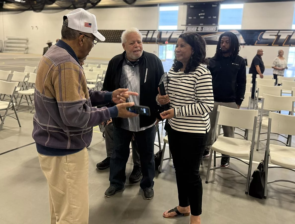 Kellie Kimbrough Mahone, the oldest daughter of the late Albert Kimbrough, talks with guests in attendance at the dedication ceremony for Kimbrough Fieldhouse on Sunday, May 25, 2025.