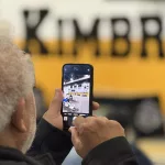 kimbroughs-18: A vibrant mural of Albert and Elbert Kimbrough, frozen in their 1950s football glory, now graces the newly christened Kimbrough Fieldhouse at Galesburg Jr./Sr. High School, unveiled during a heartfelt dedication ceremony on Sunday, May 25, 2025. (JAY REDFERN/WGIL)