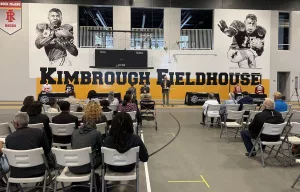 A vibrant mural of Albert and Elbert Kimbrough, frozen in their 1950s football glory, now graces the newly christened Kimbrough Fieldhouse at Galesburg Jr./Sr. High School, unveiled during a heartfelt dedication ceremony on Sunday, May 25, 2025.