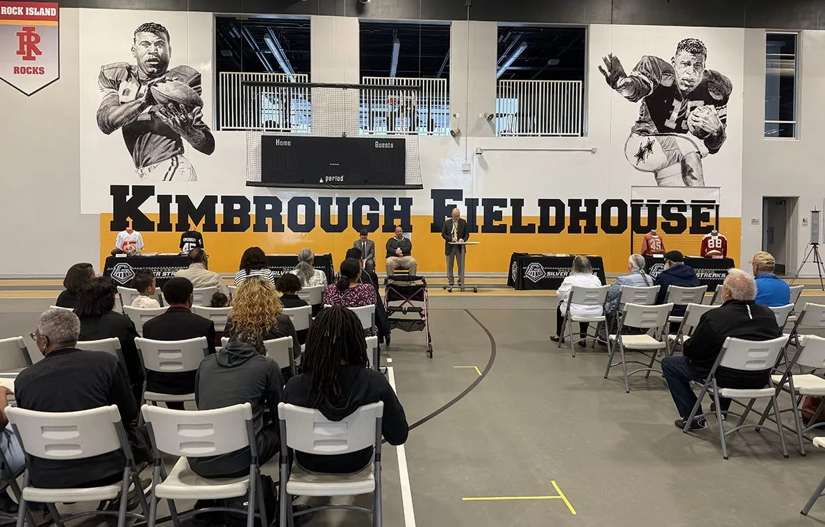 A vibrant mural of Albert and Elbert Kimbrough, frozen in their 1950s football glory, now graces the newly christened Kimbrough Fieldhouse at Galesburg Jr./Sr. High School, unveiled during a heartfelt dedication ceremony on Sunday, May 25, 2025.