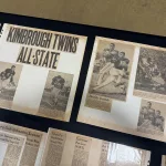 kimbroughs-13: A vibrant mural of Albert and Elbert Kimbrough, frozen in their 1950s football glory, now graces the newly christened Kimbrough Fieldhouse at Galesburg Jr./Sr. High School, unveiled during a heartfelt dedication ceremony on Sunday, May 25, 2025. (JAY REDFERN/WGIL)