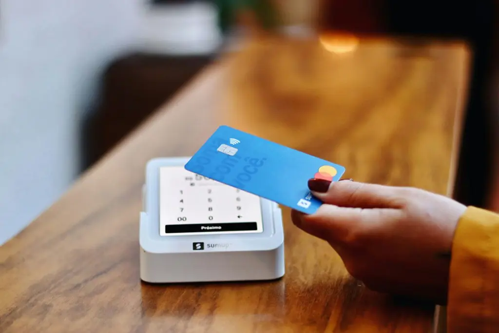 A state law banning “swipe fees” on the tax and tip portion of debit and credit card transactions could be delayed until next year. (Nathana Rebouças via Unsplash)