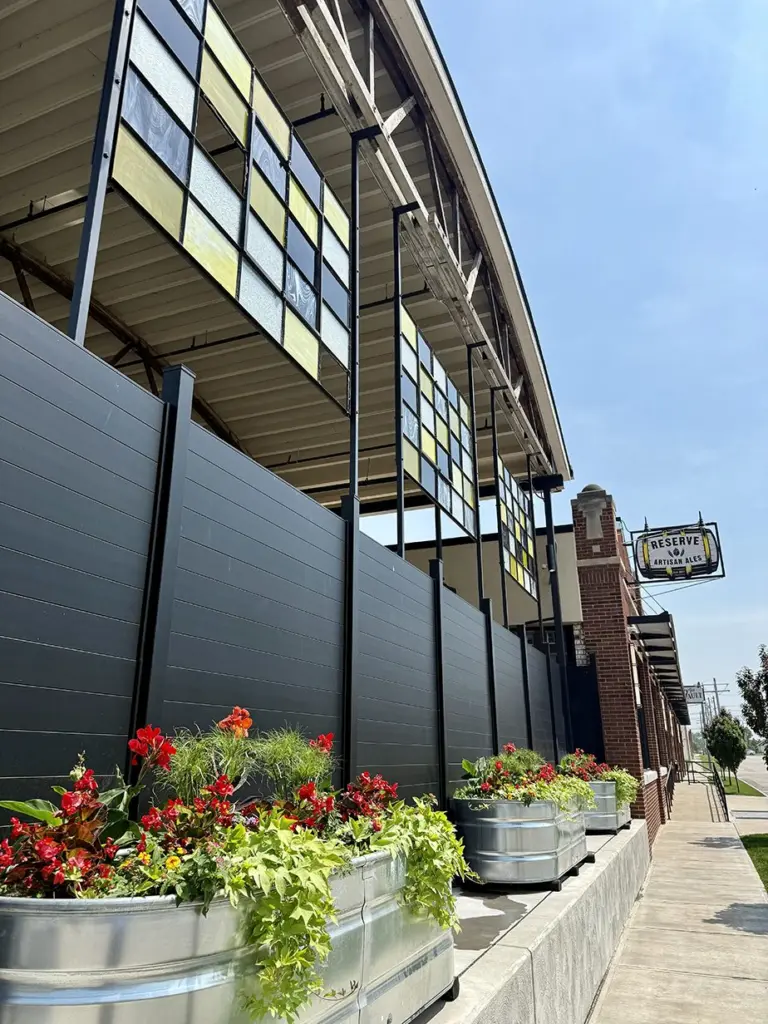 Three stained panels—featuring shades of yellow, gray, and black—were recently installed on the west-facing side of Reserve Artisan Ales, 185 S. Kellogg St. (JAY REDFERN/WGIL)