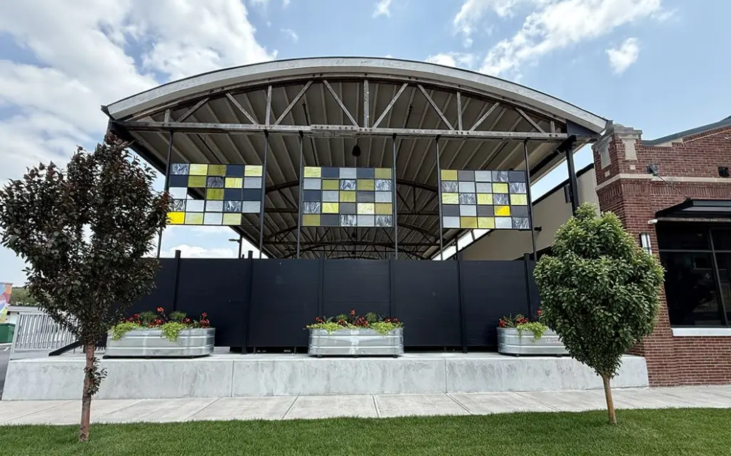 Three stained panels—featuring shades of yellow, gray, and black—were recently installed on the west-facing side of Reserve Artisan Ales, 185 S. Kellogg St. (JAY REDFERN/WGIL)