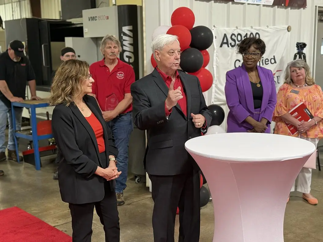 Co-owner of Pegasus Manufacturing Ray Whitehead addresses the crowd as his wife and CEO Ruth Whitehead looks on during an awards ceremony at Pegasus on June 5,2025.