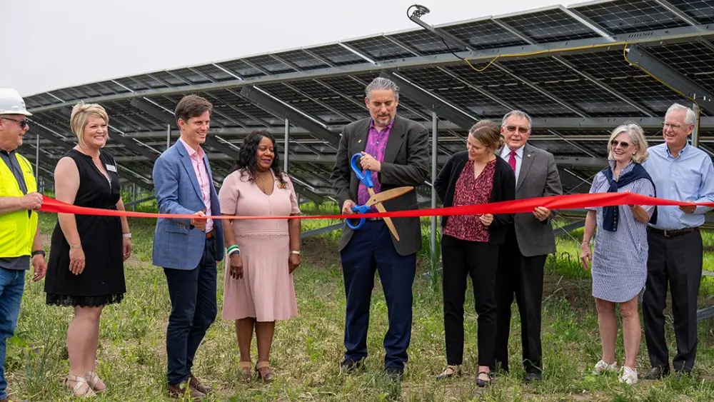 Galesburg Mayor Peter Schwartzman, center, cuts the as Nexamp and Trajectory Energy Partners celebrated the opening of Blue Grama Solar, a 4.7 megawatt community solar farm on Thursday, June 12, 2025, at 1489 S. Farnham St. in Galesburg. Other Galesburg representatives pictures are Pam Gaither with the Galesburg Area Chamber of Commerce and John Schlaf with Knox County Area Partnership. (PHOTO COURTESY NEXAMP)