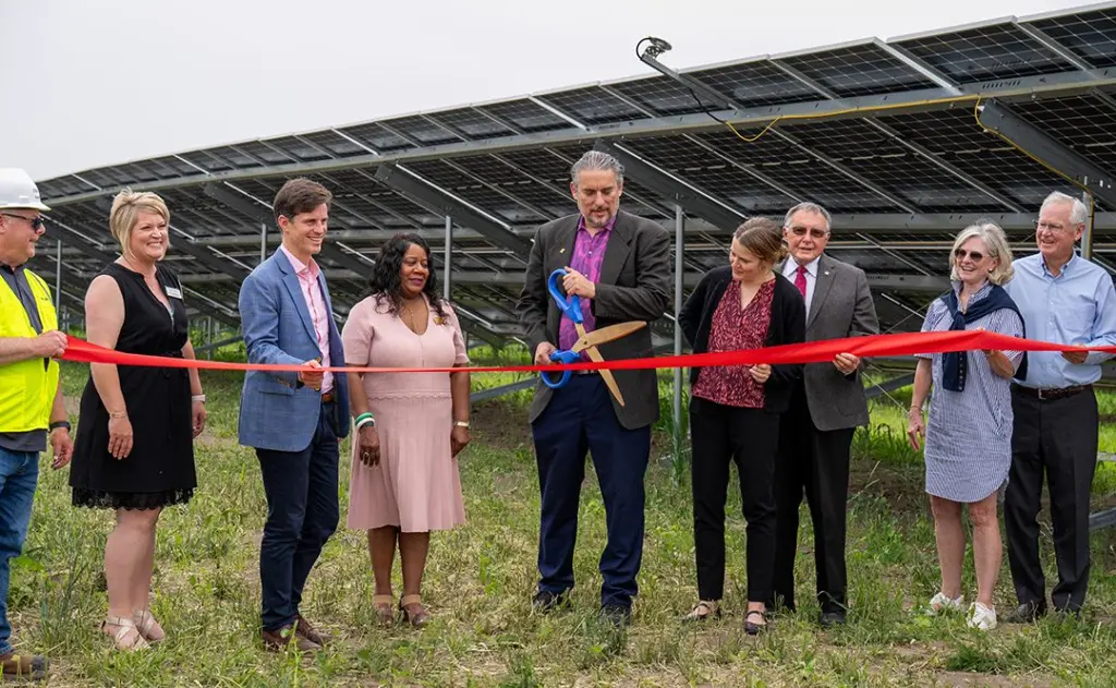 Galesburg Mayor Peter Schwartzman, center, cuts the as Nexamp and Trajectory Energy Partners celebrated the opening of Blue Grama Solar, a 4.7 megawatt community solar farm on Thursday, June 12, 2025, at 1489 S. Farnham St. in Galesburg. Other Galesburg representatives pictures are Pam Gaither with the Galesburg Area Chamber of Commerce and John Schlaf with Knox County Area Partnership. (PHOTO COURTESY NEXAMP)