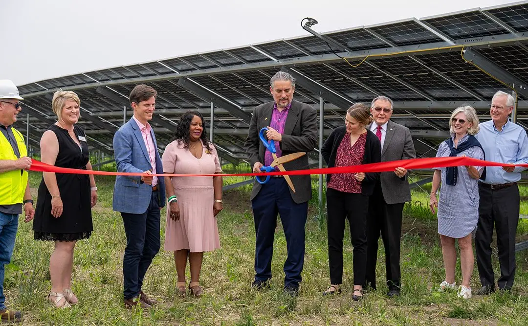 Galesburg Mayor Peter Schwartzman, center, cuts the ribbon as Nexamp and Trajectory Energy Partners celebrated the opening of Blue Grama Solar, a 4.7 megawatt community solar farm on Thursday, June 12, 2025, at 1489 S. Farnham St. in Galesburg. Other Galesburg representatives pictured are Pam Gaither with the Galesburg Area Chamber of Commerce and John Schlaf with Knox County Area Partnership. (PHOTO COURTESY NEXAMP)