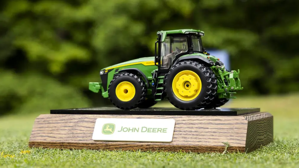 Jul 7, 2024; Silvis, Illinois, USA; A model John Deere tractor is seen as a tee box marker on the first hole during the final round of the John Deere Classic golf tournament. Mandatory Credit: Joseph Cress-USA TODAY Sports