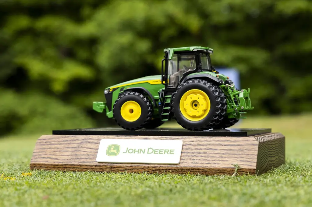 Jul 7, 2024; Silvis, Illinois, USA; A model John Deere tractor is seen as a tee box marker on the first hole during the final round of the John Deere Classic golf tournament. Mandatory Credit: Joseph Cress-USA TODAY Sports
