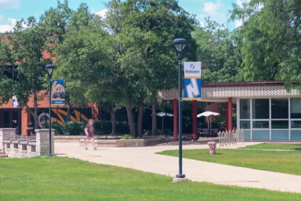 Someone walks past the student center at Northeastern Illinois University in Chicago. It is one of nine state universities that will begin offering direct admission to qualifying Illinois students. (Capitol News Illinois photo by Andrew Adams)