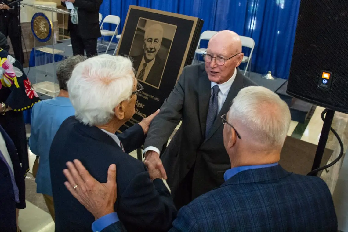 Former Gov. Jim Edgar shakes hands with admirers at a May 28 event in Springfield to dedicate the Illinois State Library reading room in his honor. (Capitol News Illinois photo by Jerry Nowicki)