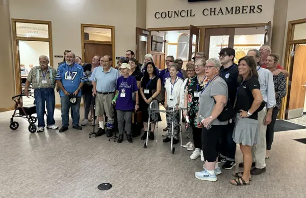 VNA Community Services supporters assemble after after the Monday, Sept. 15, 2025, City Council meeting.