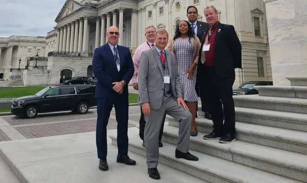 L-R: Cook County Deputy Clerk Edmund Michalowski, Tazewell County Chief Deputy Clerk Dan Sullivan, Tazewell County Clerk & Recorder of Deeds John C. Ackerman, Cook County Clerk & Recorder of Deeds Monica Gordon, Lake County Clerk & Recorder of Deeds Anthony Vega, and Knox County Clerk & Recorder of Deeds Scott Erickson at the United States Capital.