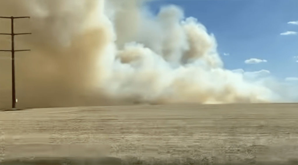 Area fire crews battled a large field fire near Rio on Sunday, as dangerously dry and windy conditions fueled the blaze.