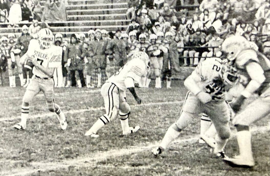 Quarterback Mark Reed looks over the field during a game in 1980