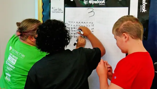 Students do math problems at an elementary school in Springfield. (Capitol News Illinois photo by Andrew Campbell)