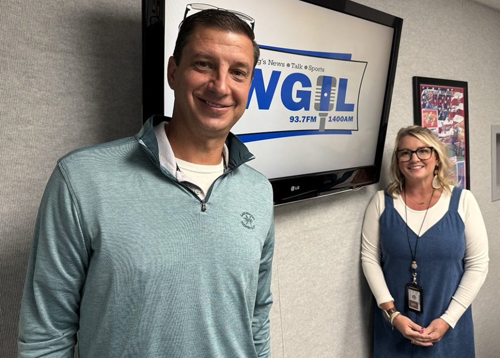 Aaron Furrow, left, President of the Galesburg Athletic Booster Club, and Mindi Ritchie, District 205 Assistant Superintendent of Human Resources and Student Supports. (WGIL)
