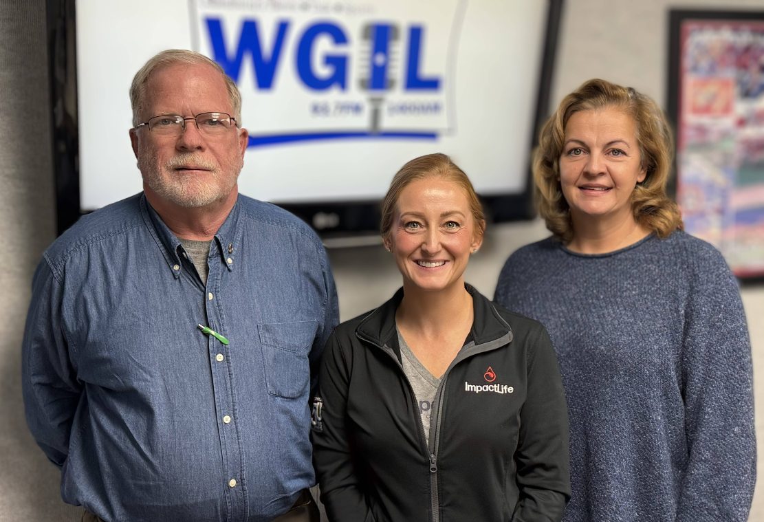 Tori Tebbitt from ImpactLife, center, and Lions Club President Laun Dunn, and Secretary Ron Beebe.
