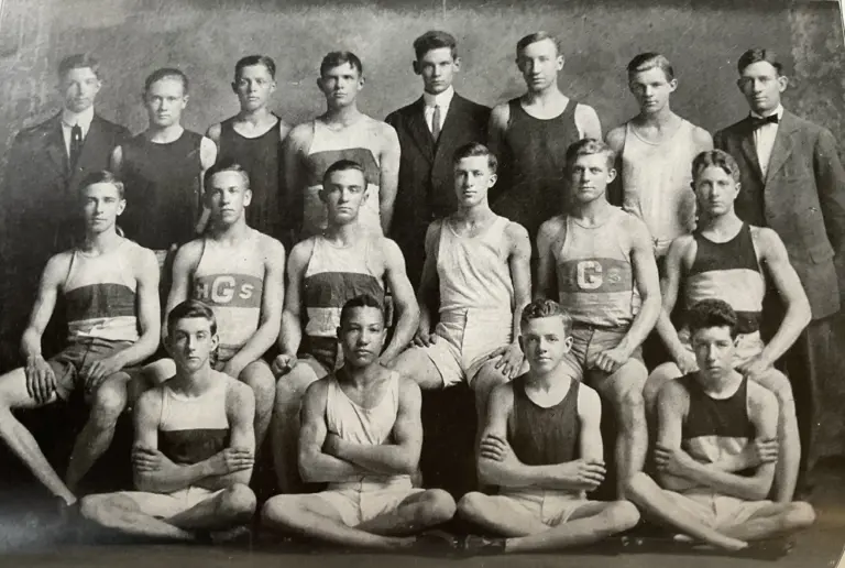 Black-and-white team photo of the 1911–12 Galesburg High School track team; freshman Adolph “Ziggy” Hamblin is seated front row, second from the left.