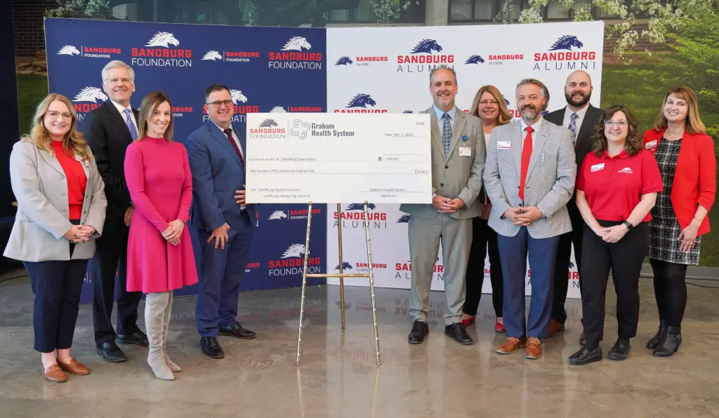 Sandburg on Tuesday announced the naming of the Graham Health System Science & Technology Center Atrium following a $500,000 commitment by Graham Health System in support of student success. Pictured L-R: Kassidy Klinedinst, Sandburg assistant manager of advancement; Bob Senneff, Graham Health System CEO; Allison Sours, Graham Health System president & COO; Dr. Seamus Reilly, Sandburg president; Eric Rahn, director of Graham Medical Group’s western region; Michelle Daly, Graham Health System senior vice president of clinic operations; Eric Johnson, Sandburg vice president of advancement; Jake Green, Graham Health System senior director of business development; Deborah Moreno, Sandburg Foundation president; and Stacey Rucker, Sandburg assistant manager of alumni engagement & advancement communications. (BILL GAITHER/Sandburg)