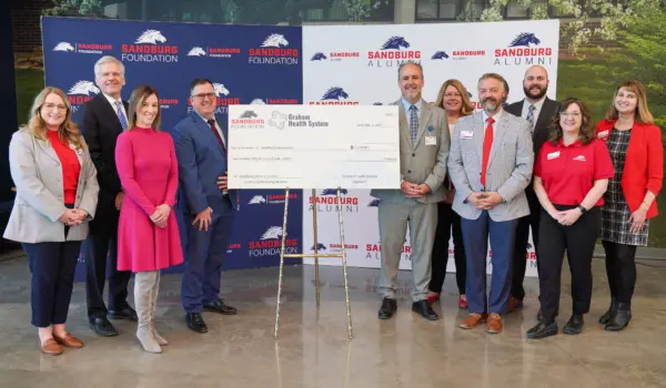 Sandburg on Tuesday announced the naming of the Graham Health System Science & Technology Center Atrium following a $500,000 commitment by Graham Health System in support of student success. Pictured L-R: Kassidy Klinedinst, Sandburg assistant manager of advancement; Bob Senneff, Graham Health System CEO; Allison Sours, Graham Health System president & COO; Dr. Seamus Reilly, Sandburg president; Eric Rahn, director of Graham Medical Group’s western region; Michelle Daly, Graham Health System senior vice president of clinic operations; Eric Johnson, Sandburg vice president of advancement; Jake Green, Graham Health System senior director of business development; Deborah Moreno, Sandburg Foundation president; and Stacey Rucker, Sandburg assistant manager of alumni engagement & advancement communications. (BILL GAITHER/Sandburg)