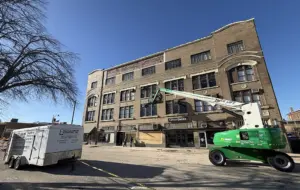 tto Baum Company restoration equipment and workers repairing the Weinberg Arcade building in downtown Galesburg