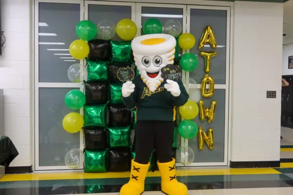 Tommy Tornado mascot at Abingdon-Avon schools with spirit signs and balloons