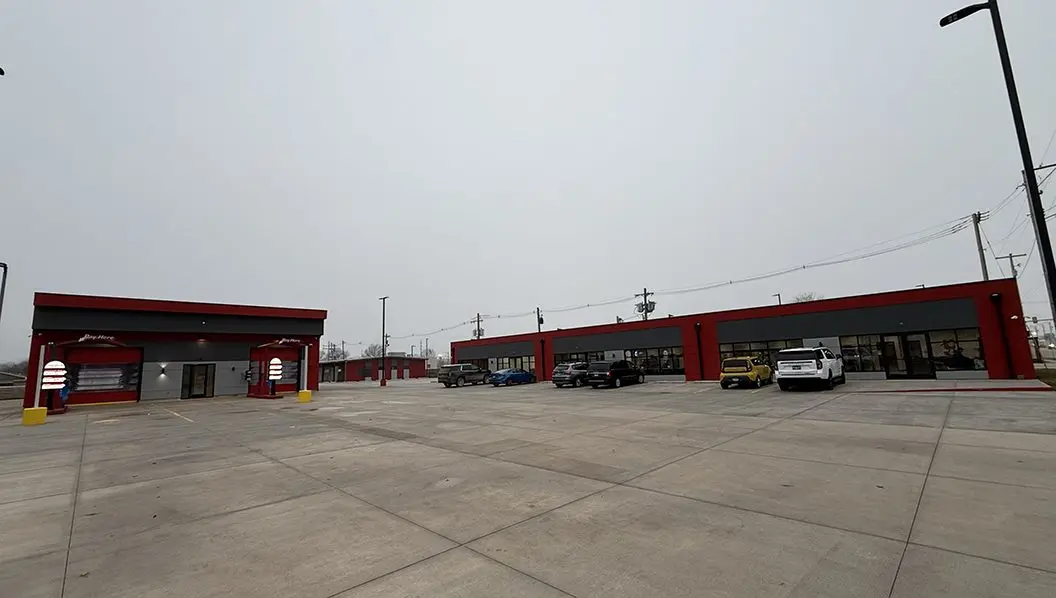 Wide exterior shot of the new Sudzy’s Laundromat and Precision Touchless Car Wash facility in Galesburg
