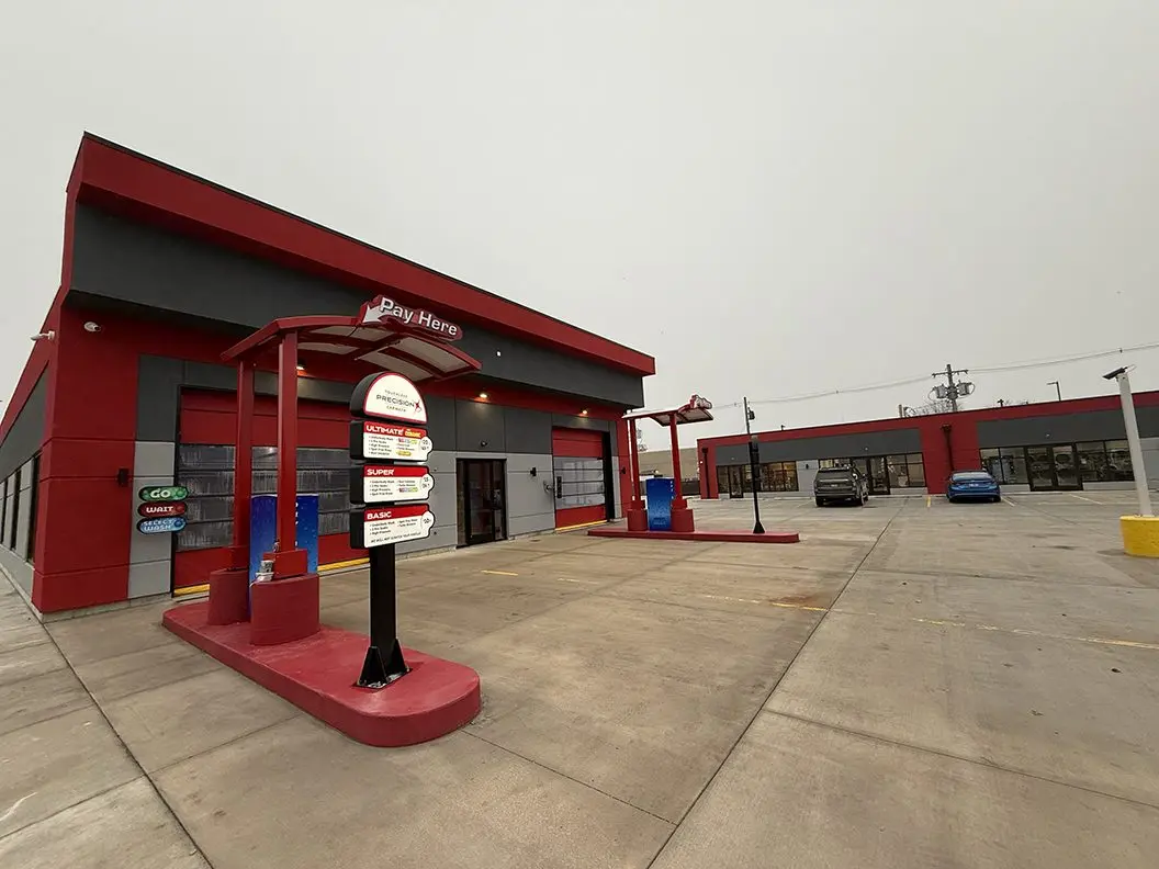 Close-up of pay station and wash menu at Precision Touchless Car Wash in Galesburg