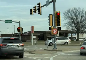 Traffic signal displaying "No Right Turn on Red" at Carl Sandburg Drive and North Henderson Street intersection