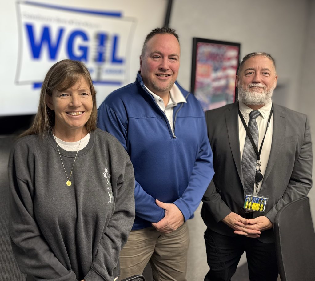 Photo of Kristi Mustain, Zach Maher, and Jeff Ewing in the WGIL studio discussing the Super Steak Fry fundraiser.