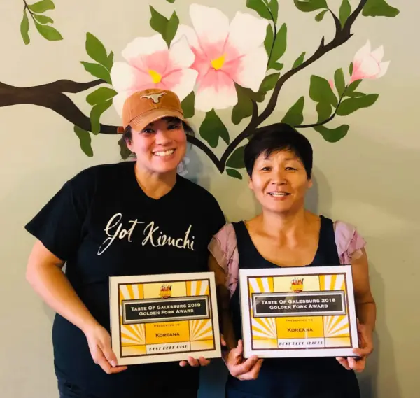Amber Jordan and Ok Hyon (Kim) Curtis, co-owners of Koreana Restaurant in Galesburg, holding Taste of Galesburg awards.
