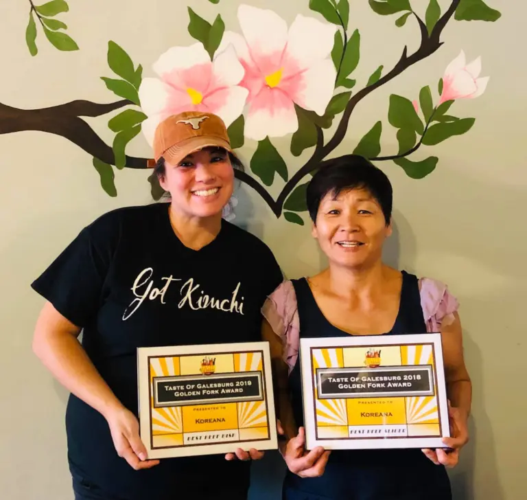 Amber Jordan and Ok Hyon (Kim) Curtis, co-owners of Koreana Restaurant in Galesburg, holding Taste of Galesburg awards.