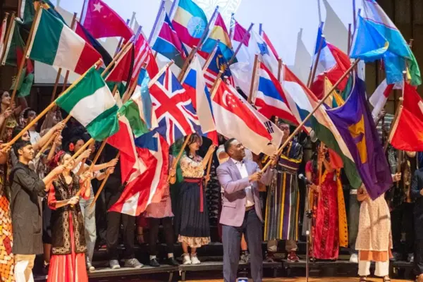 Knox College students in flag parade at International Fair, Kresge Recital Hall, Galesburg