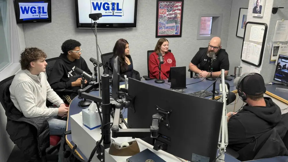 Galesburg Area Vocational Center director Adam Seaney and students Caleb Claeys, Elan Baggott, Araceli Chavez and McKenzie Goff in WGIL studio interview.