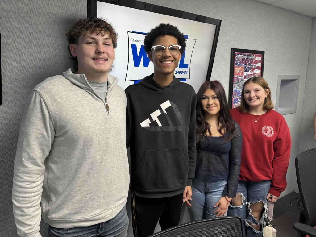 GAVC students Caleb Claeys, Elan Baggott, Araceli Chavez and McKenzie Goff posing in WGIL 1400AM studio, Galesburg.