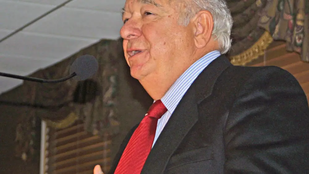 Joseph A. “Joe” Angotti speaking at a podium