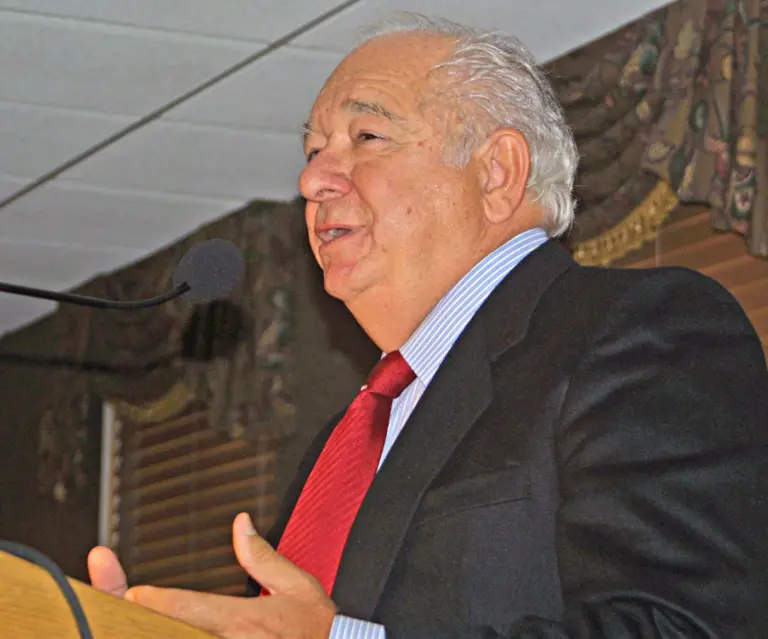 Joseph A. “Joe” Angotti speaking at a podium