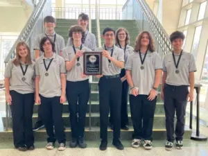 Galesburg High School students holding Scholastic Bowl championship award