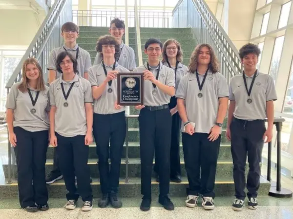 Galesburg High School students holding Scholastic Bowl championship award